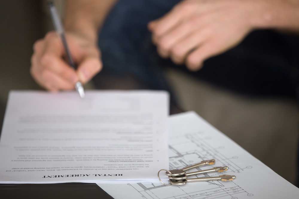 Person signing storage rental agreement