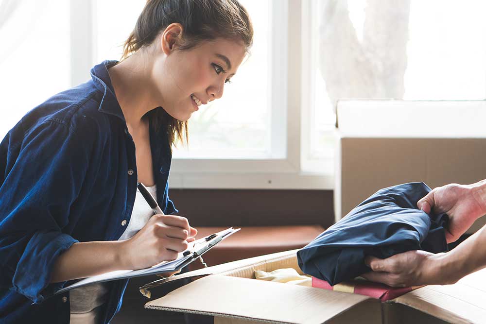 Woman putting together a moving checklist